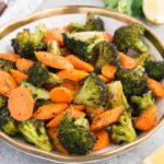 oven roasted broccoli and carrots in a bowl