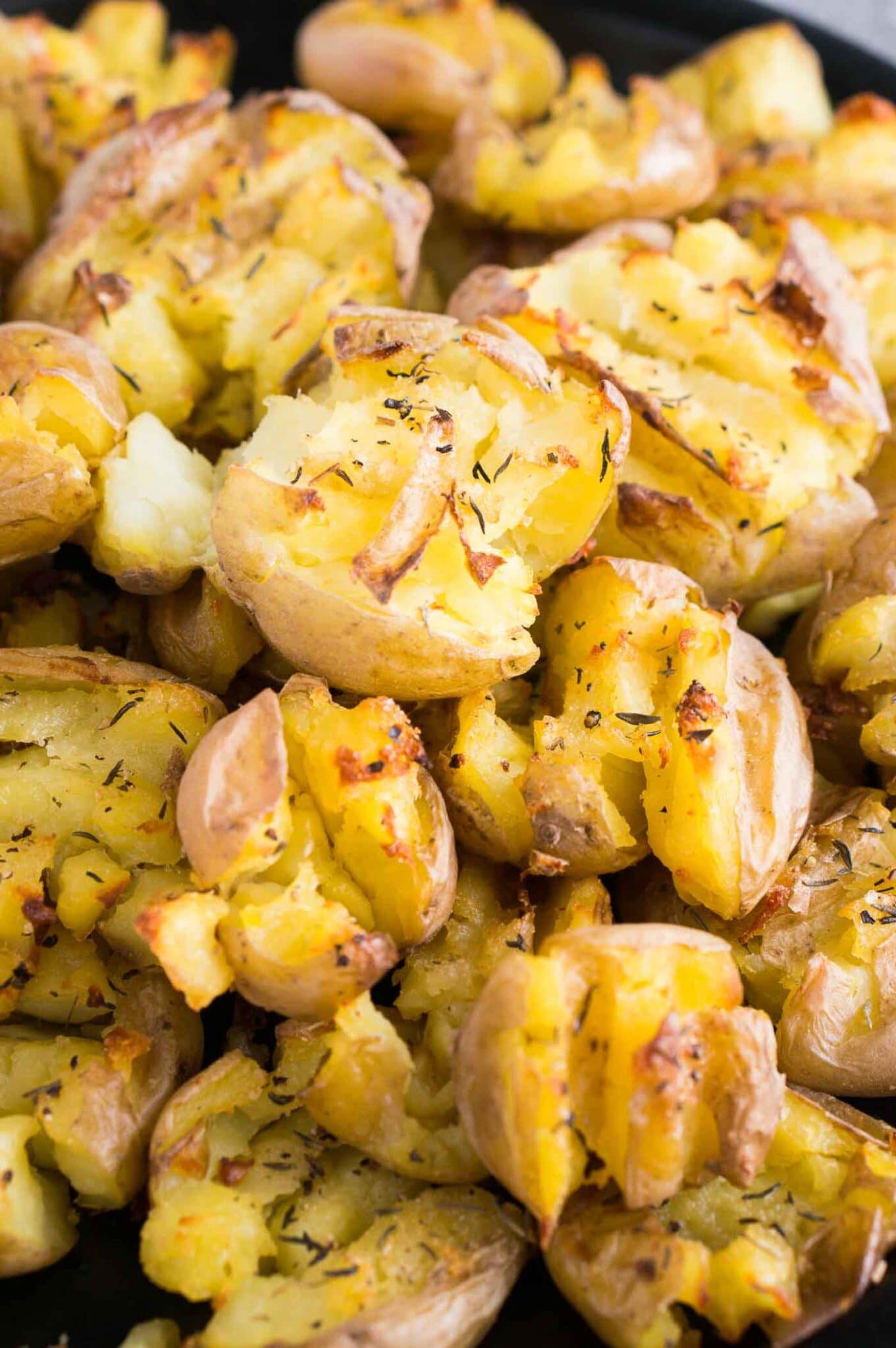 close up image of smashed baby potatoes