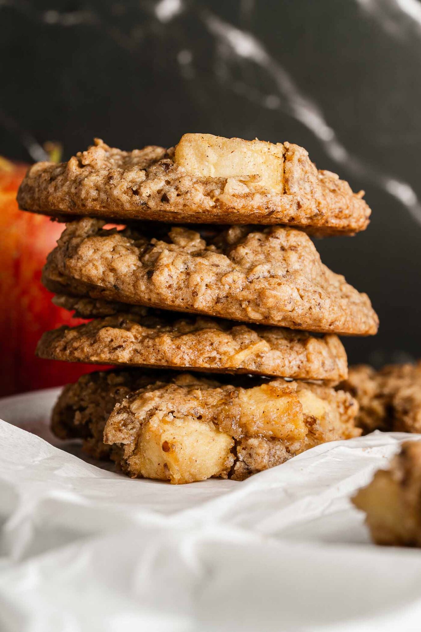 close up image of stacked apple oatmeal cookies