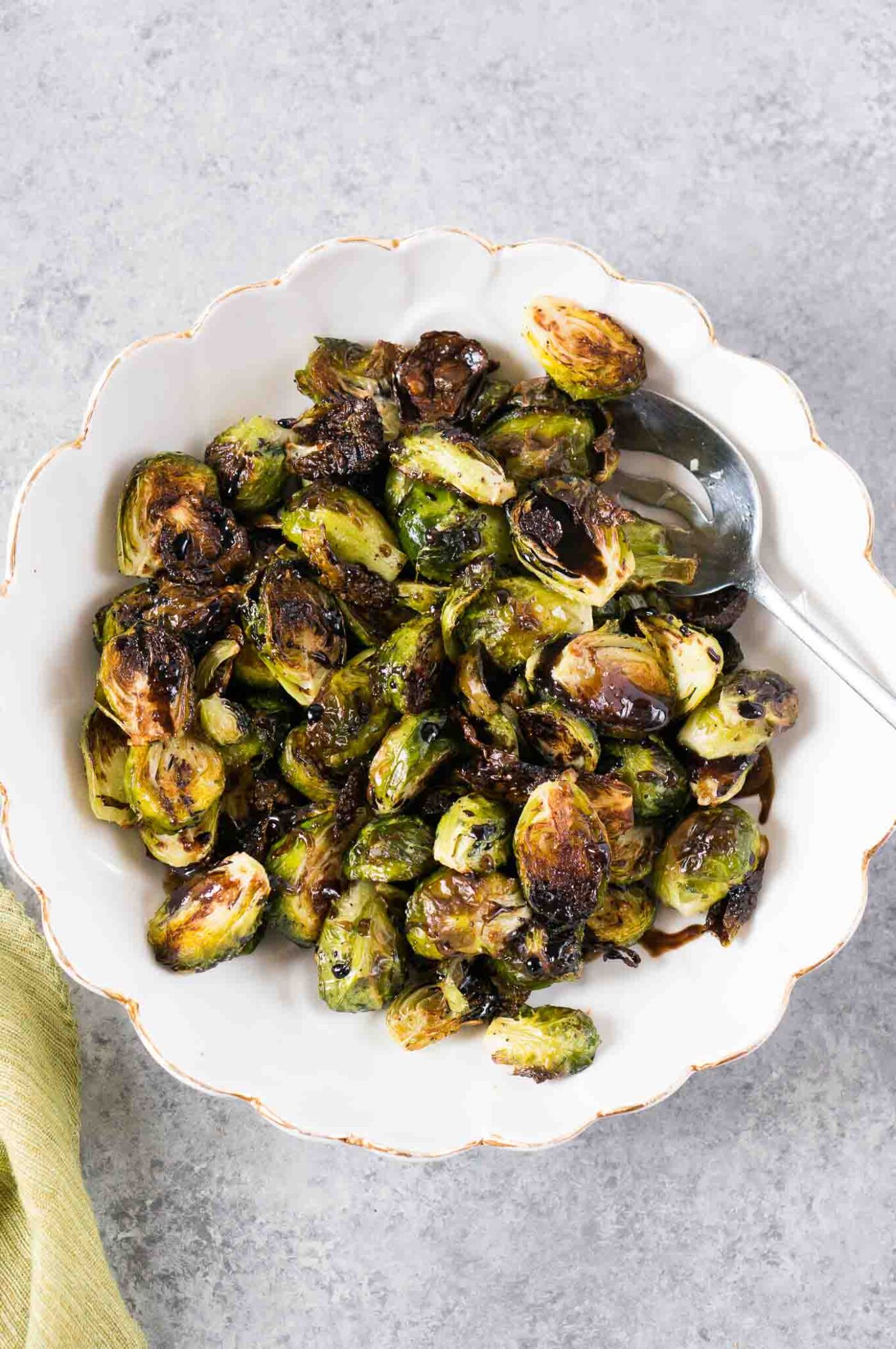 roasted Brussel sprouts with balsamic glaze served in a serving bowl