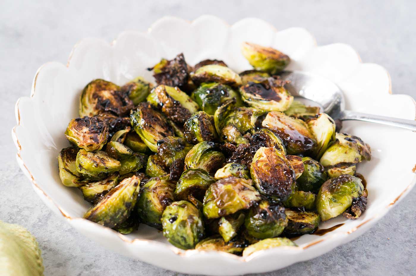 oven roasted Brussel sprouts with balsamic honey vinaigrette in a bowl