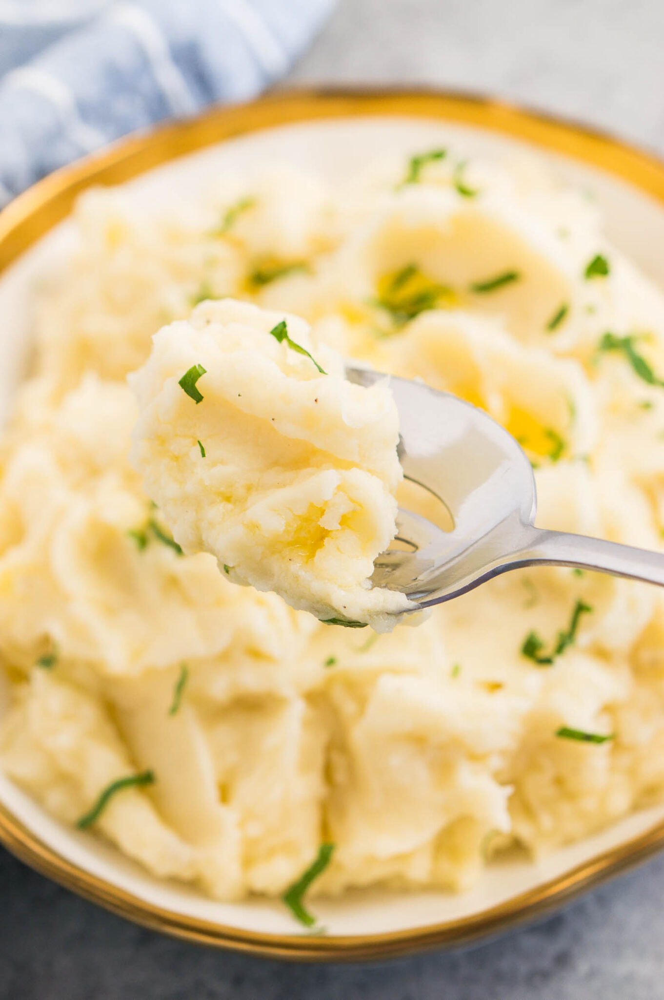 a scoop of creamy potatoes on a serving spoon