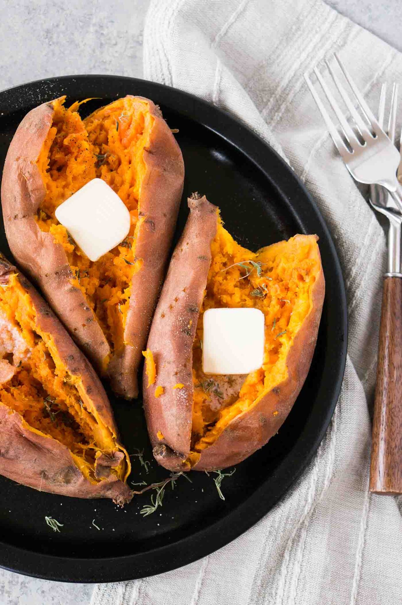 instant pot sweet potatoes with butter on a plate