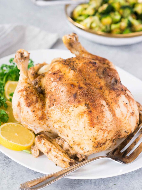 whole chicken cooked in the instant pot served on a platter
