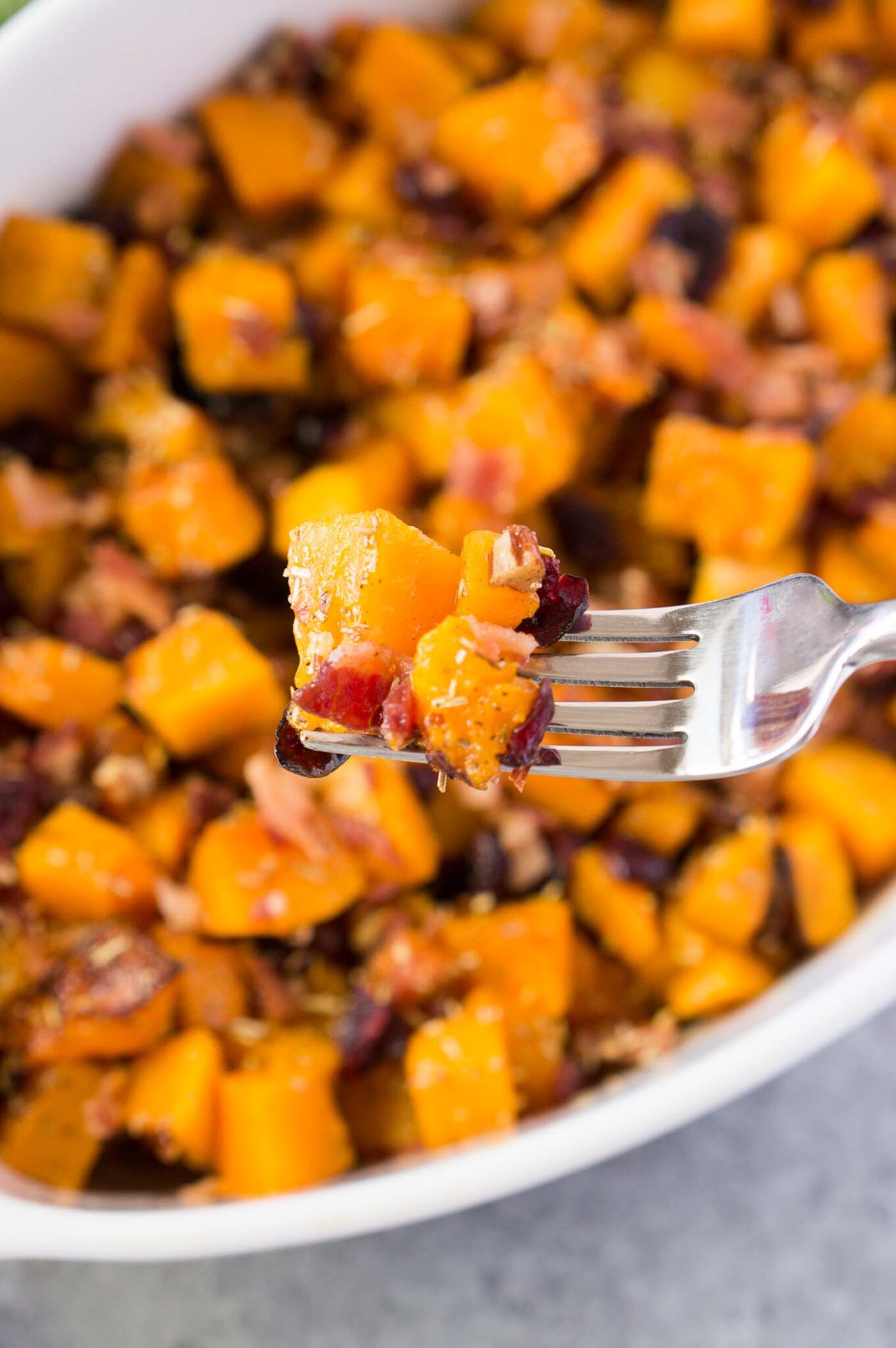 taking a bite of roasted butternut squash