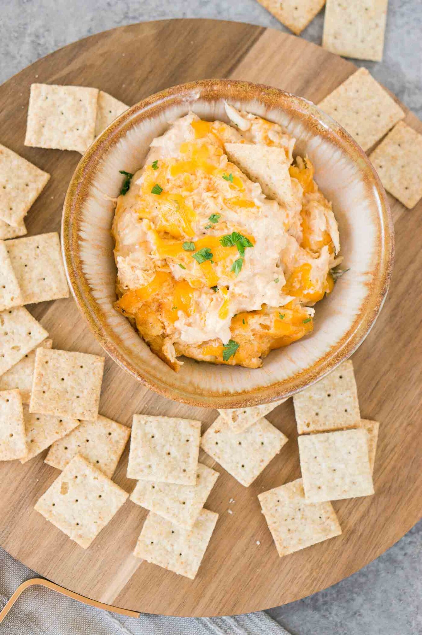 image from top of hot crab dip in a bowl served with crackers