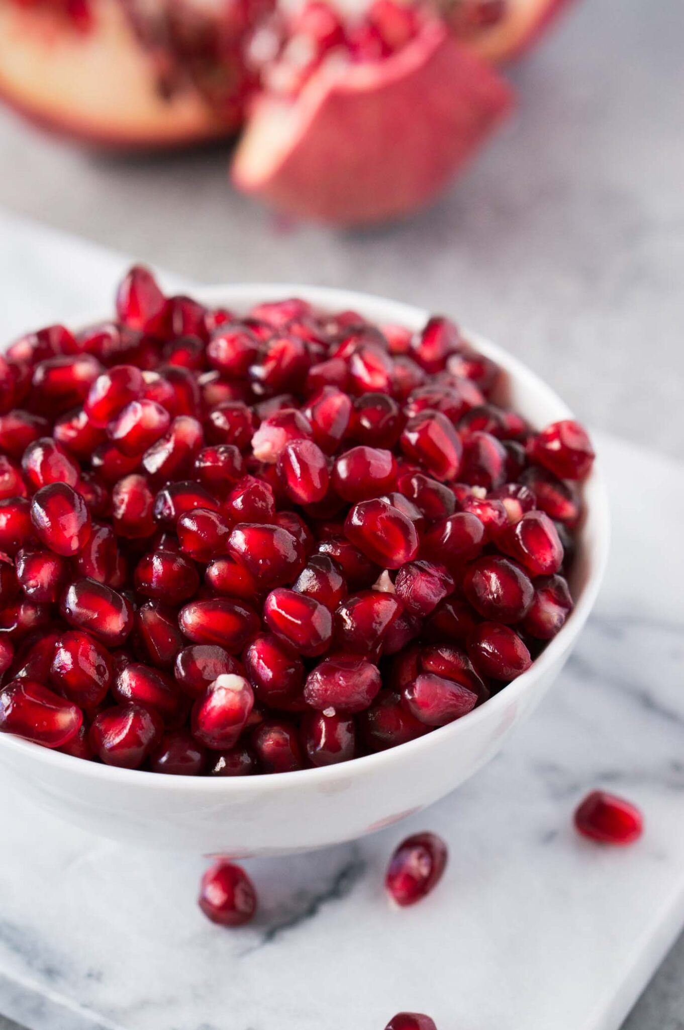 close up image of pomegranate arils in a bowl