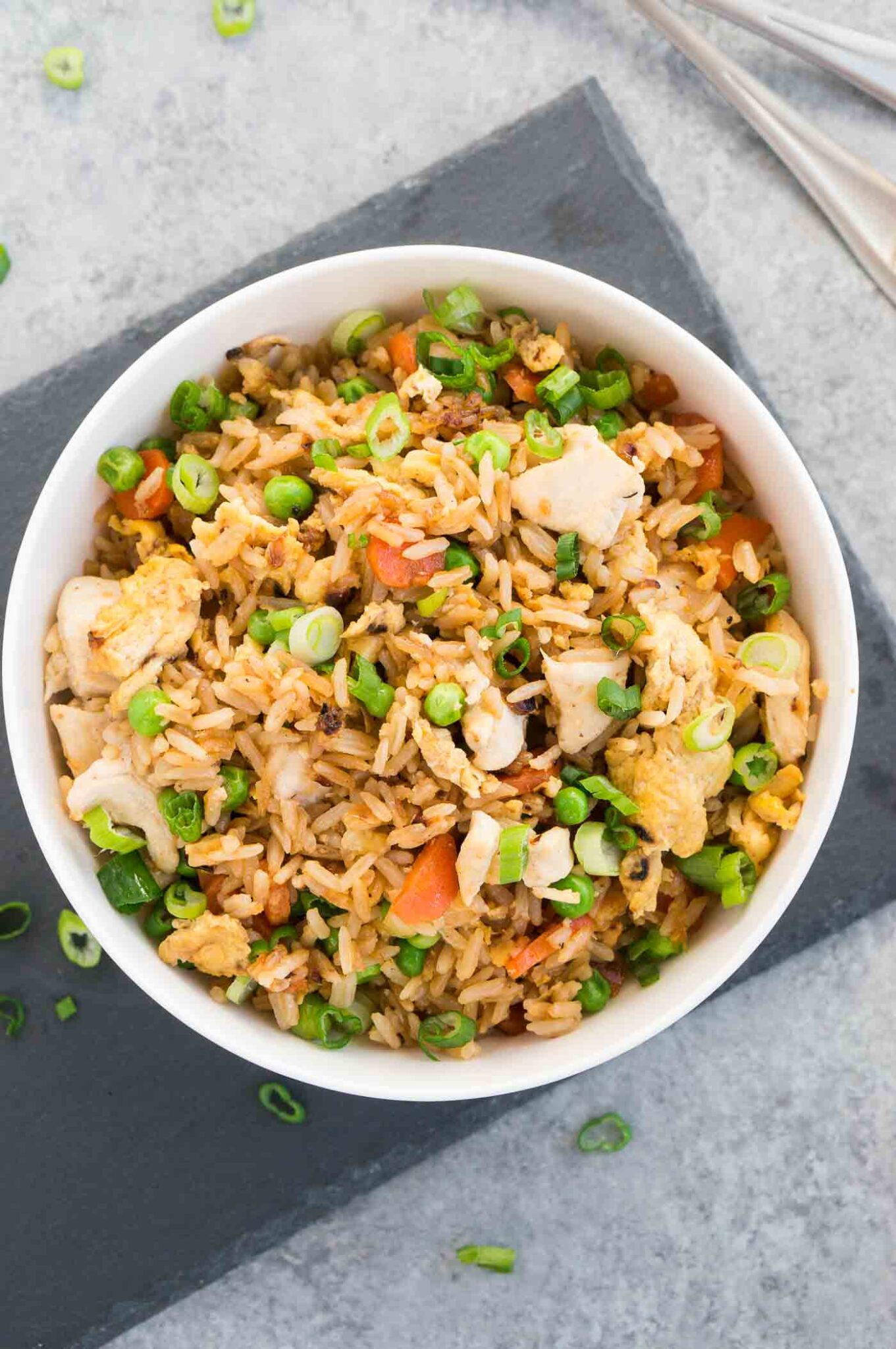fried rice and chicken in a white bowl