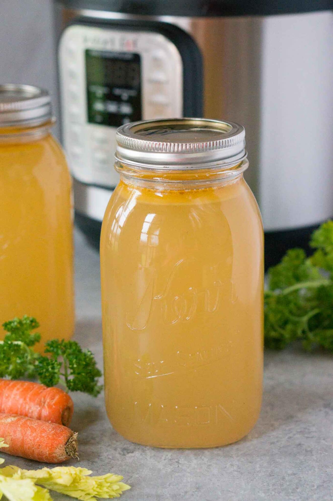 chicken stock in a jar with instant pot in background