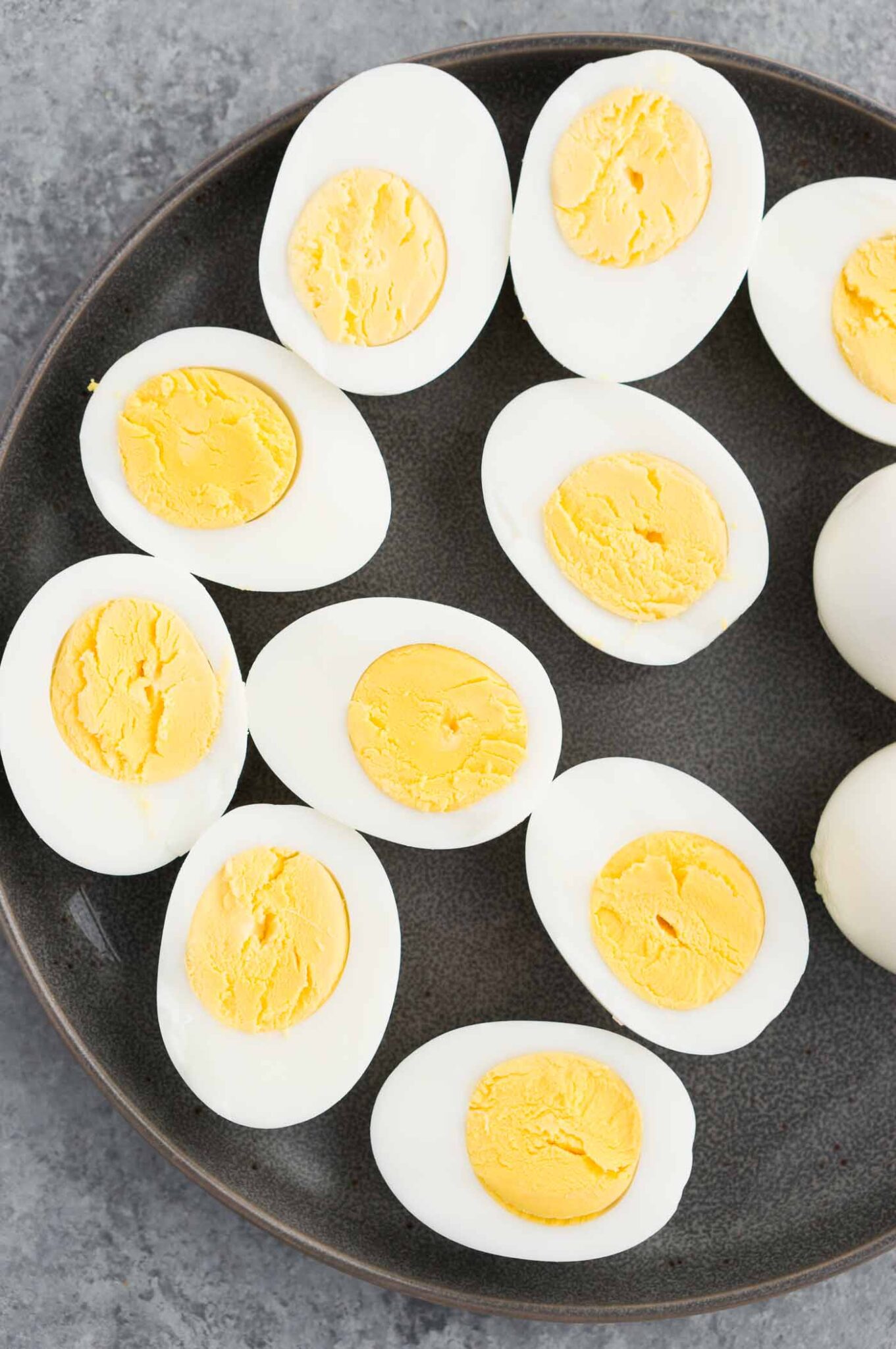 close up image of cut hard boiled eggs on a plate