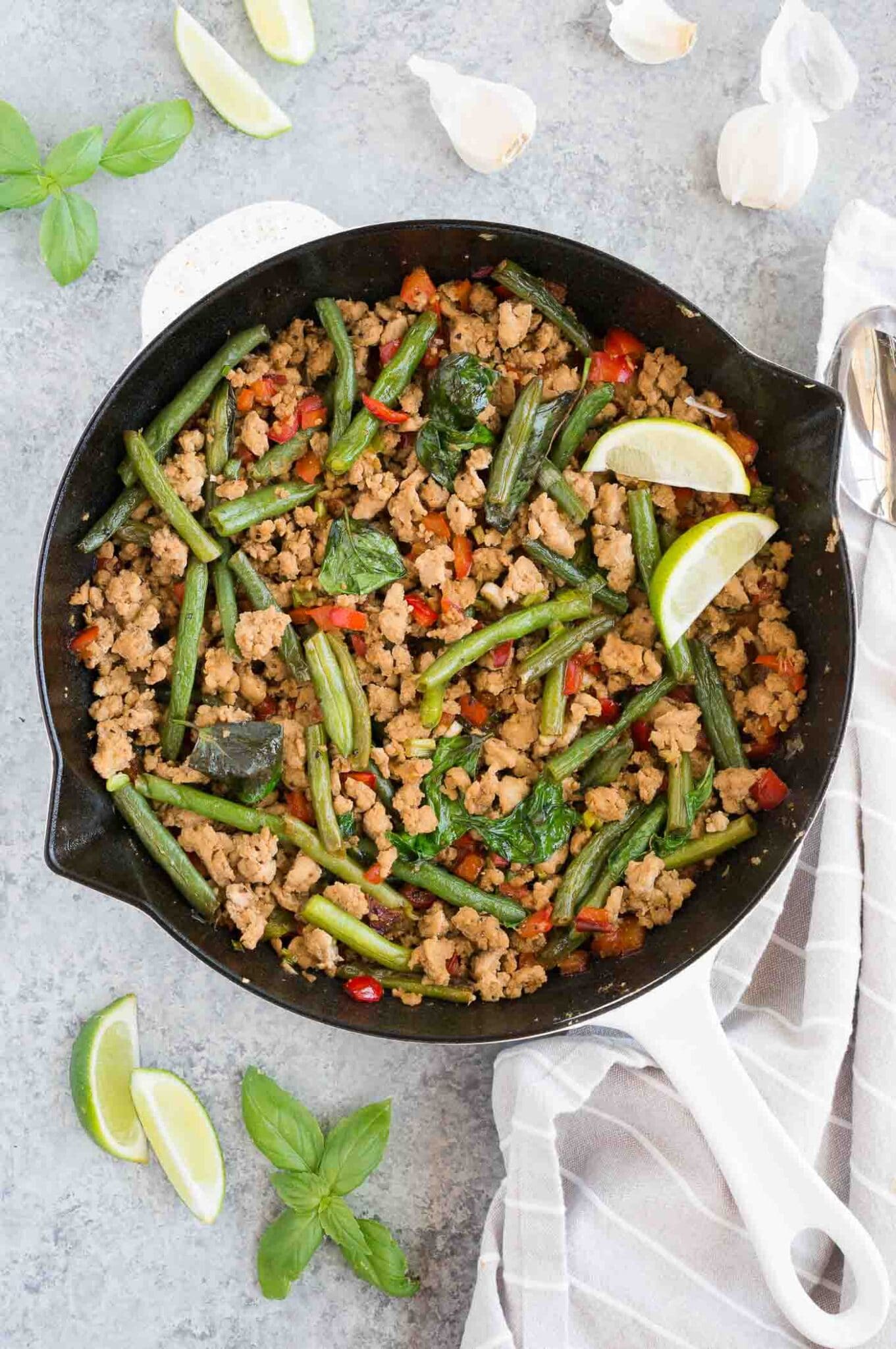 Thai chicken and green beans stir fry in a skillet
