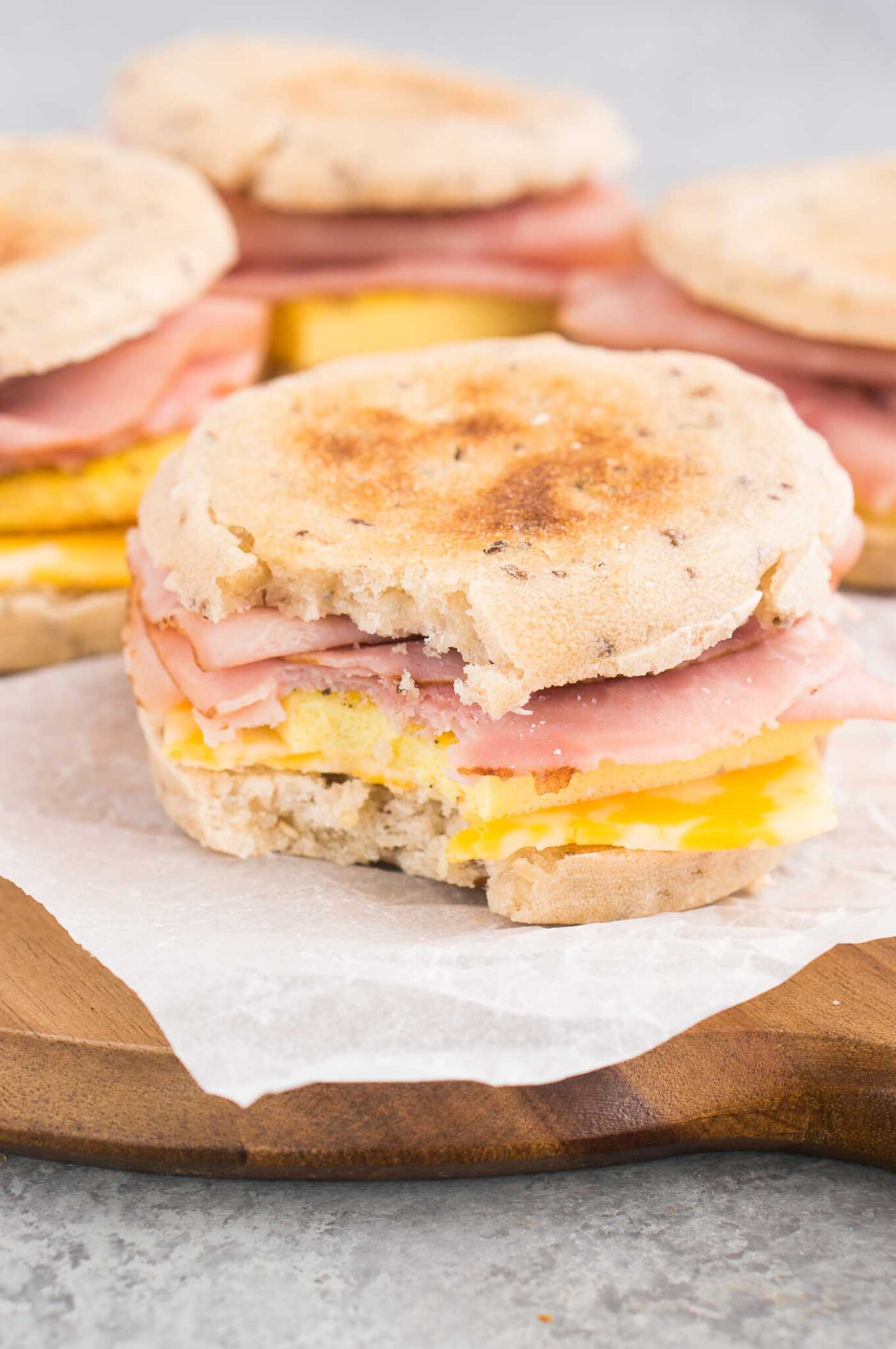 egg ham and cheese sandwich on a board