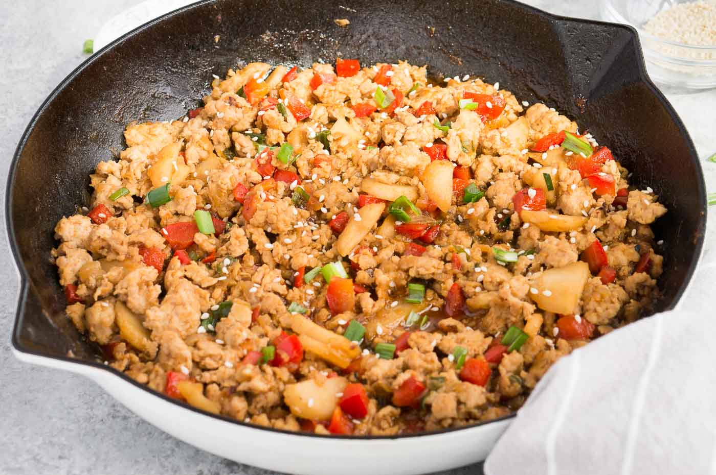 close up image of Asian chicken dish in skillet