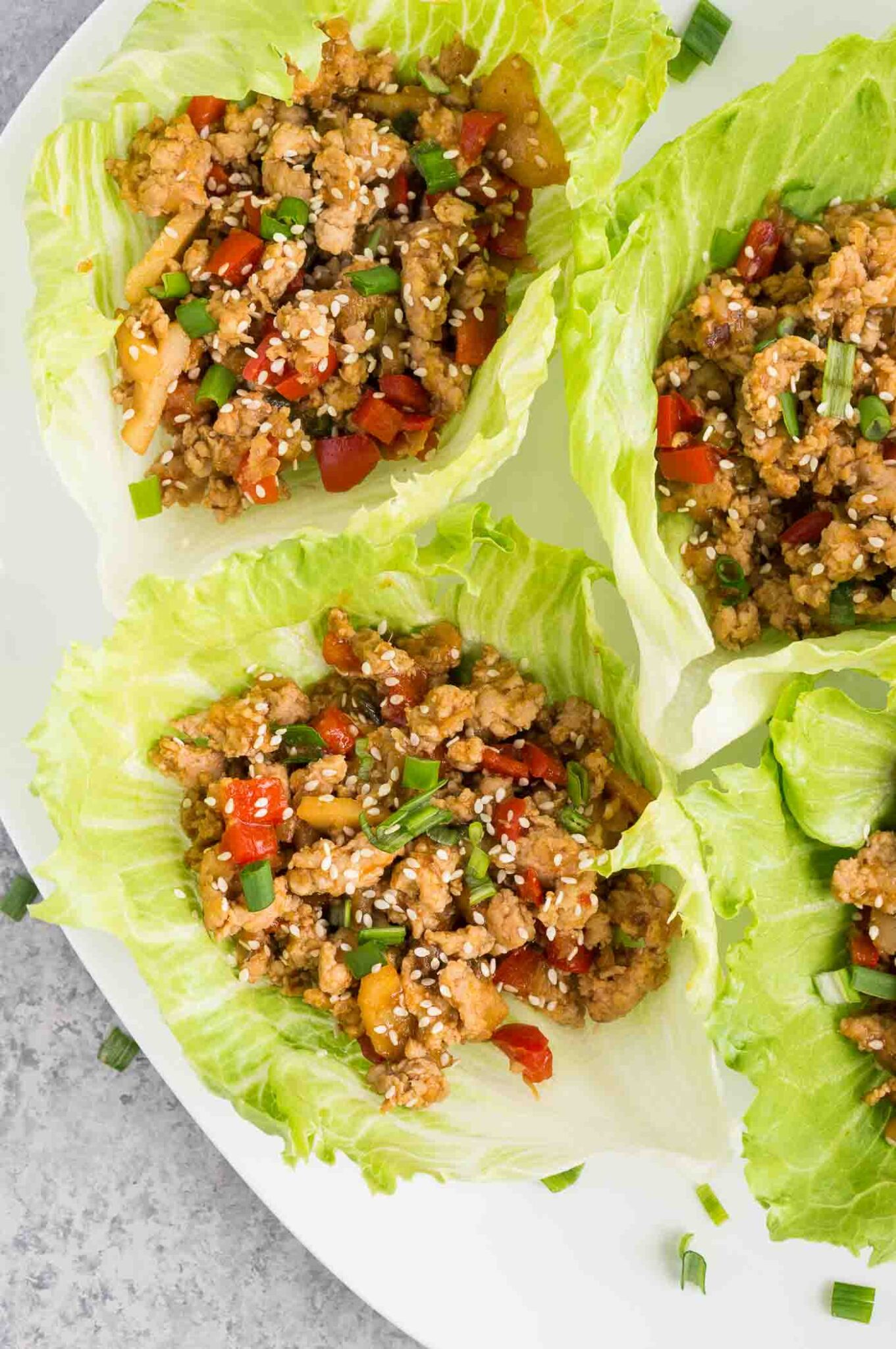 close up image of chicken lettuce wraps on a plate