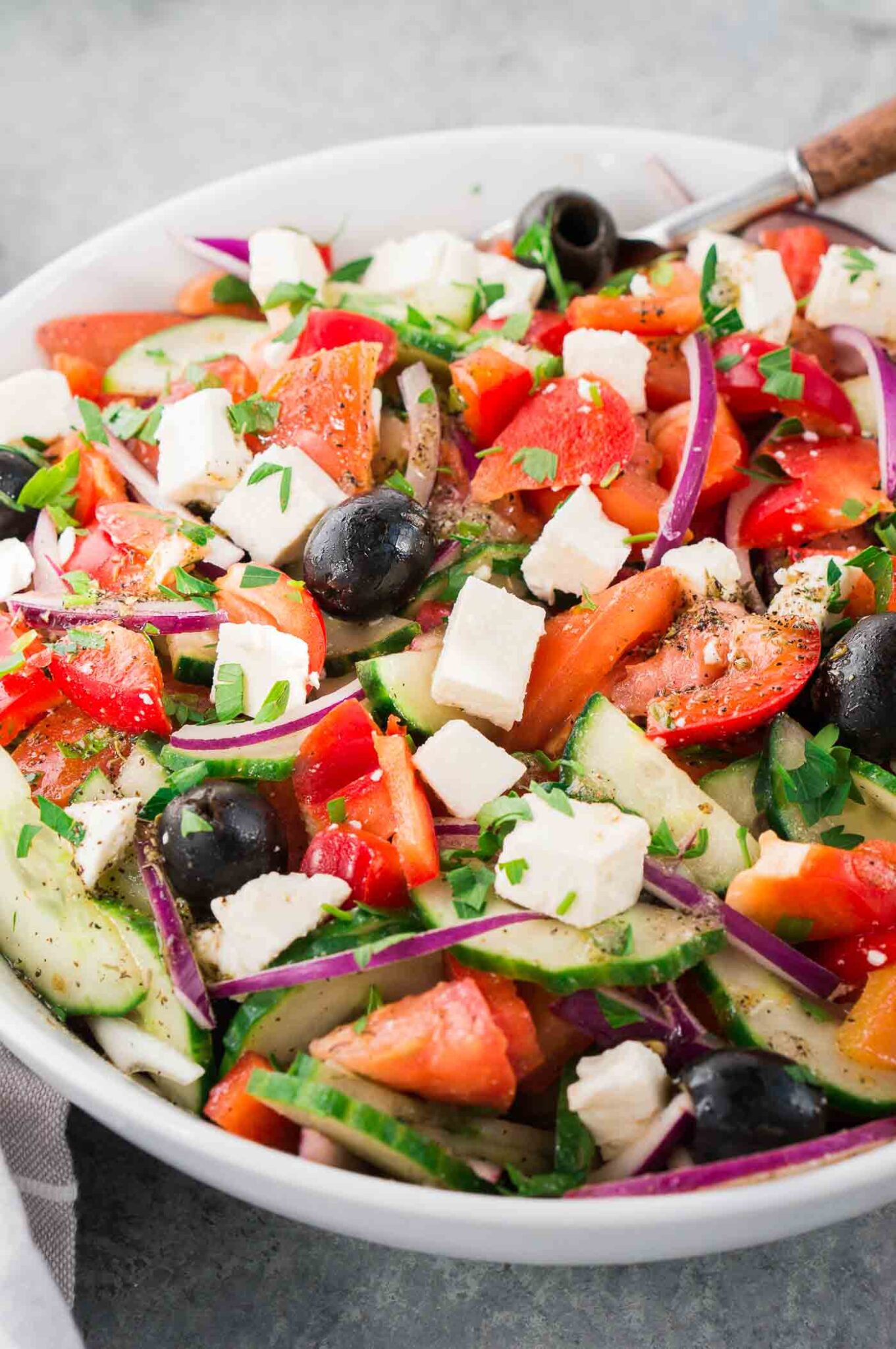 greek salad in a white salad bowl