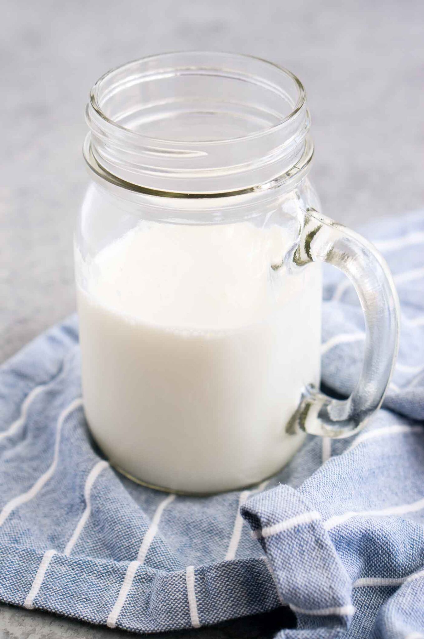 close up image of buttermilk in a glass jar