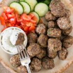 greek meatballs (keftedes) with cucumbers tomatoes and tzatziki sauce
