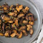 sauteed mushrooms on a gray plate