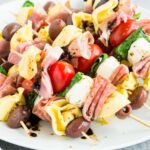 antipasto skewers on a white plate
