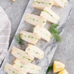 cucumber sandwiches on a serving board