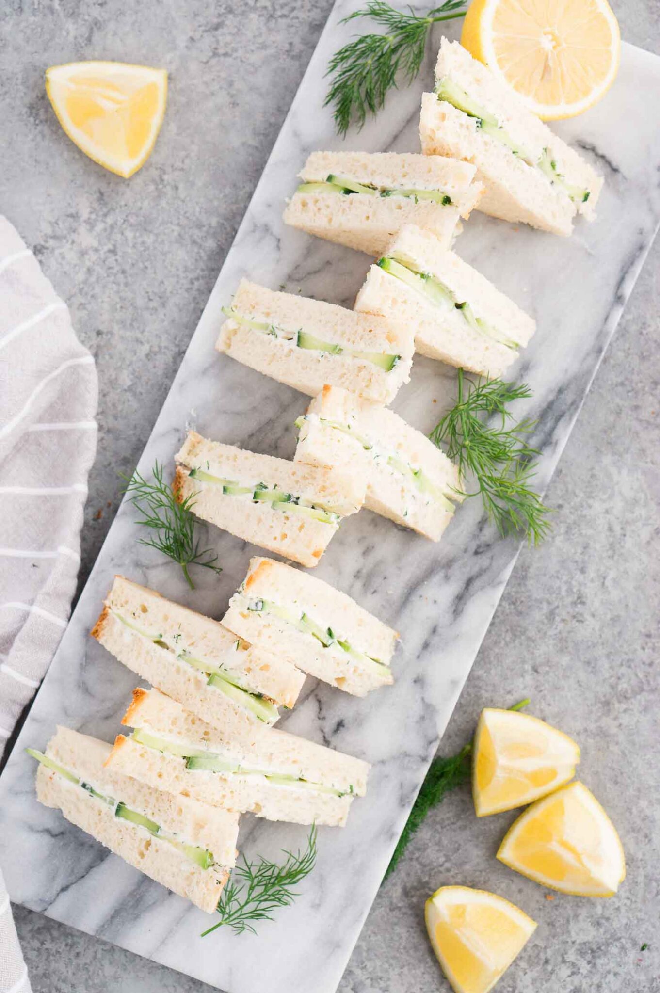cucumber sandwiches on a serving board