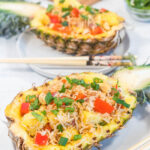halved pineapple filled with pineapple fried rice
