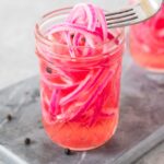pickled red onions in a jar
