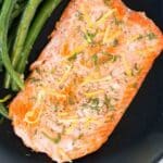 pin of sous vide cooked salmon on a black plate
