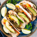 Instant Pot Steak Fajitas on a plate with fixings