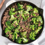 ground beef and broccoli cooked in a skillet