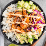salmon rice bowl with veggies and spicy mayo