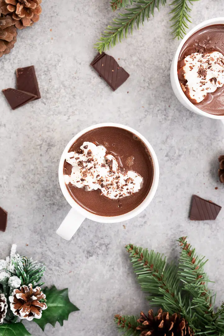 Mug of healthy hot chocolate topped with a swirl of whipped cream