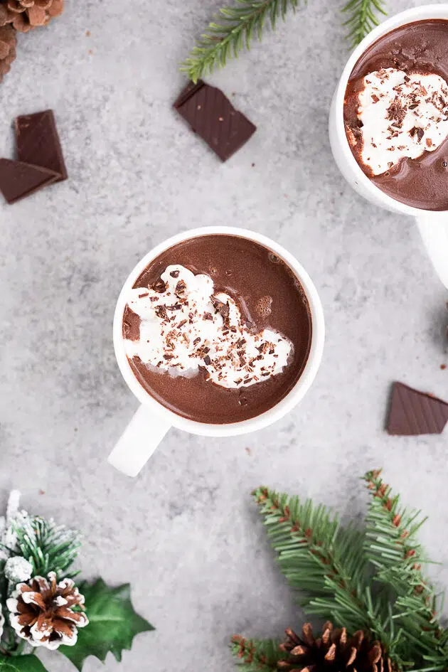 Dairy-free hot chocolate in a mug, garnished with chocolate shavings