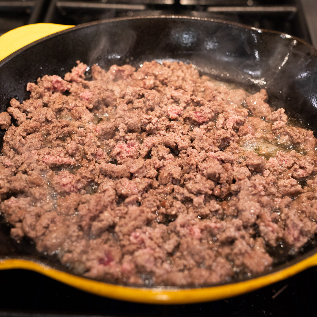browning ground beef in a skillet