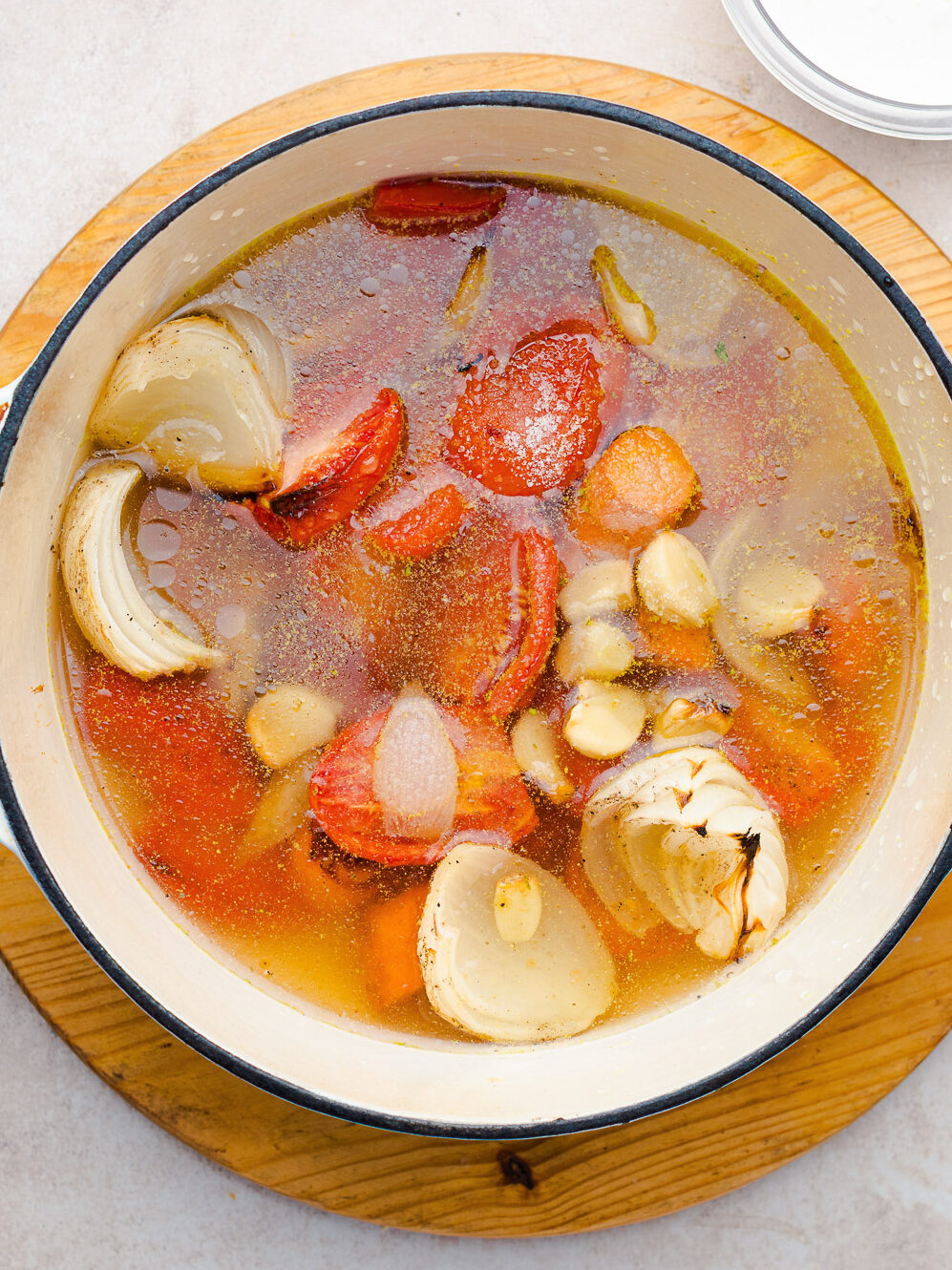 simmering roasted vegetables in a pot