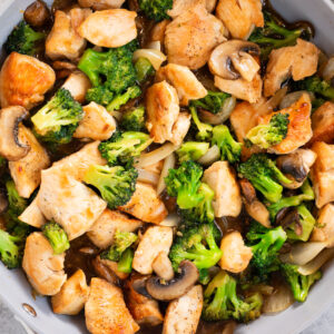 chicken and broccoli stir fry in a skillet