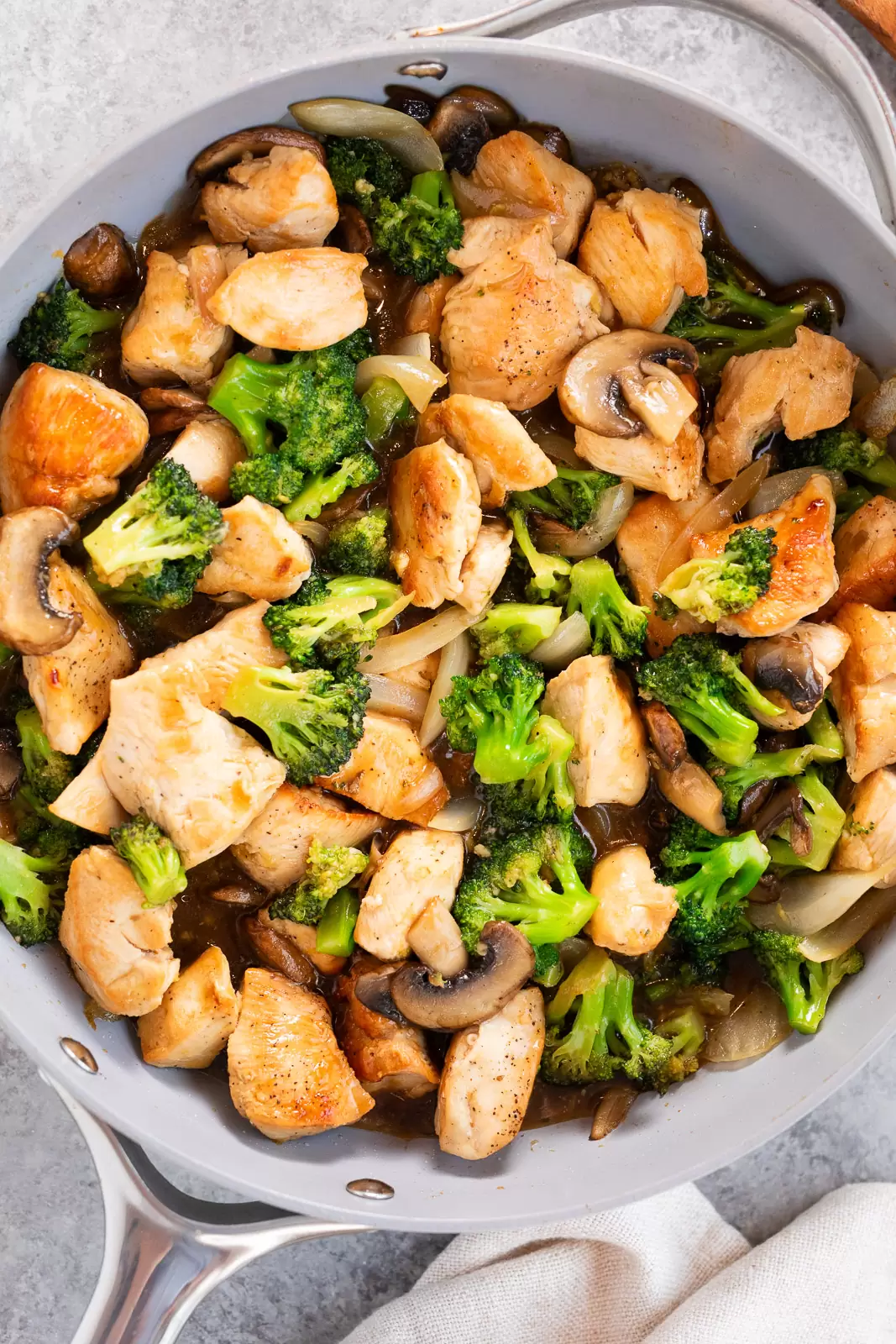 chicken and broccoli stir fry in a skillet