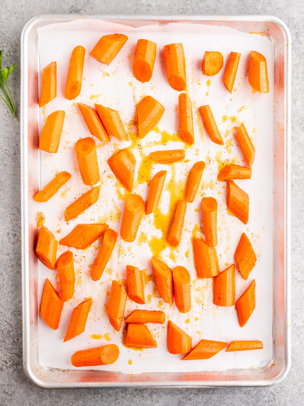 honey glazed carrots on a baking sheet