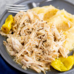 Mississippi chicken served over mashed potatoes