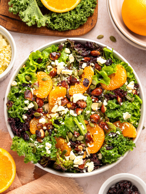 citrus salad with mixed greens in a bowl