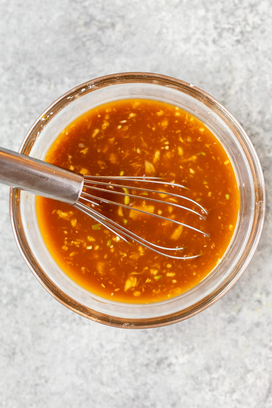 Homemade stir fry sauce made with soy sauce, vegetable stock, honey, garlic, ginger, and cornstarch for healthy vegetable stir fry