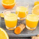 Ginger Turmeric Citrus Juice Shots in glass shots