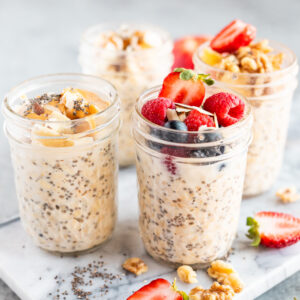 easy overnight oats recipe in jars made with 3 main ingredients and topped with fruit and nuts