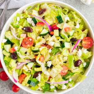 Italian chopped salad tossed with homemade dressing, romaine lettuce, fresh vegetables, olives, and feta cheese