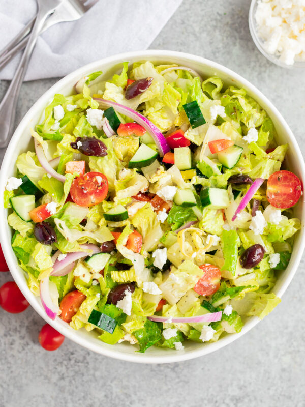 Italian chopped salad tossed with homemade dressing, romaine lettuce, fresh vegetables, olives, and feta cheese