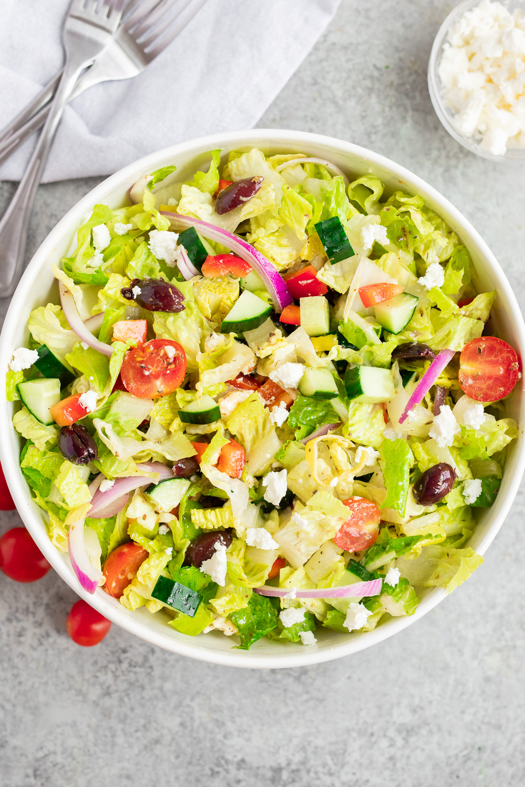 Italian chopped salad tossed with homemade dressing, romaine lettuce, fresh vegetables, olives, and feta cheese