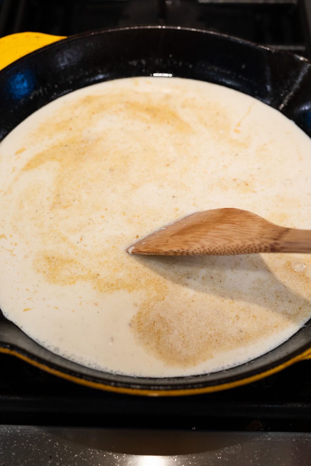 creating creamy garlic Parmesan sauce