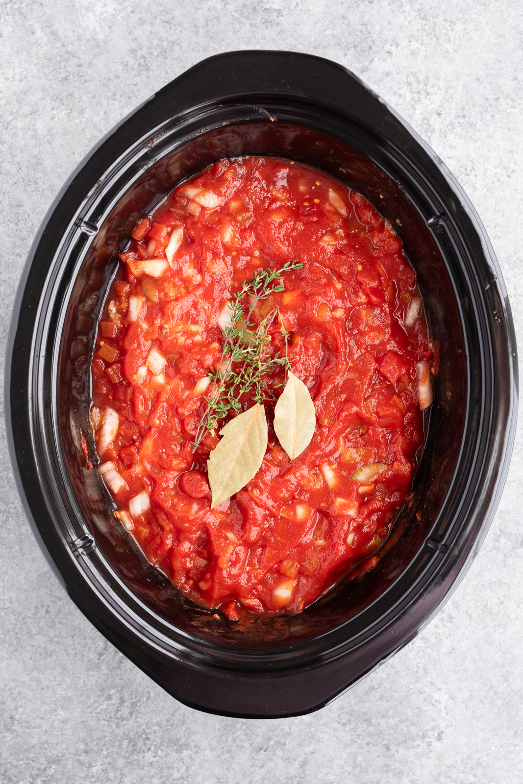 making ragu sauce in the slow cooker