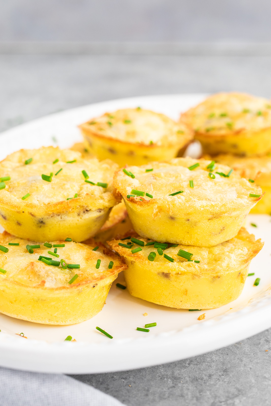 stacked egg muffins on a plate