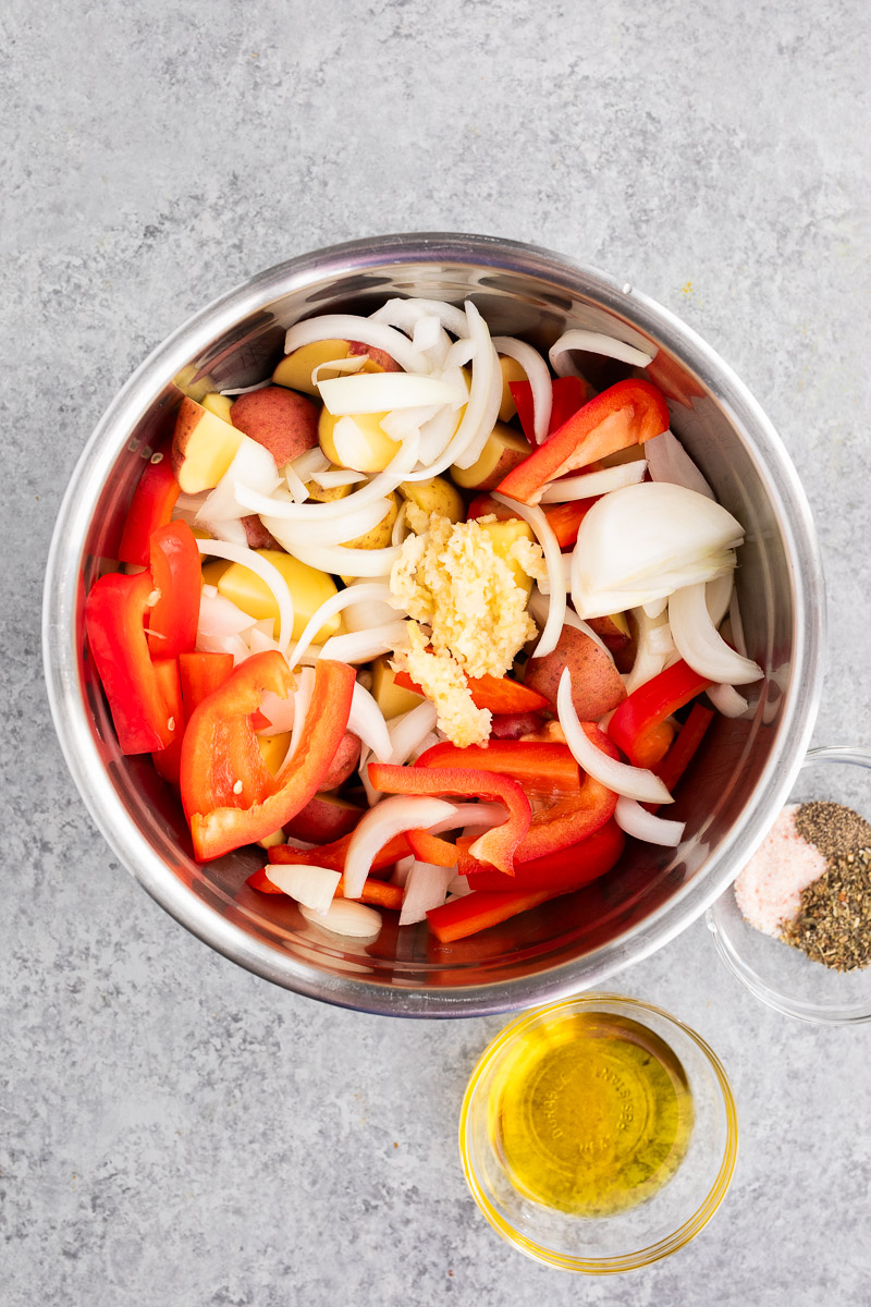 sliced vegetables and sausage in a bowl